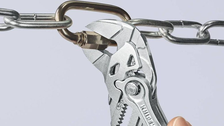 Knipex pliers wrench opening hex nut on a chain link