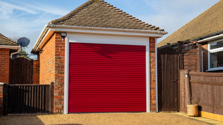 Garage with a red insulated door