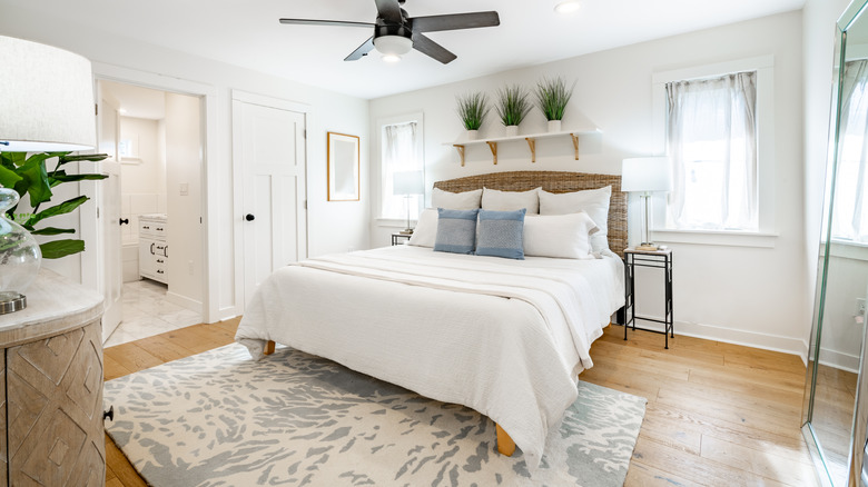 bedroom with matte finish wide-plank hardwood floors