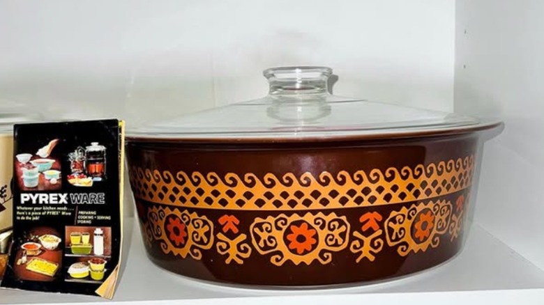 A Pyrex "Big Bertha" casserole dish in the brown Polynesian colorway.