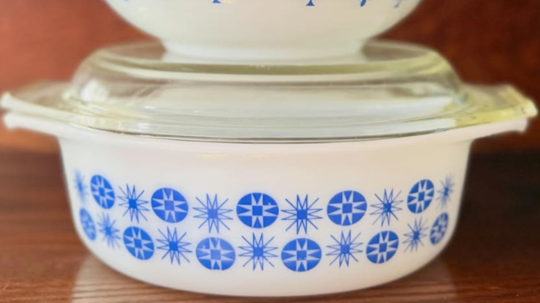 A Pyrex blue and white New Mexico casserole dish paired with a Pyrex dish from Argentina
