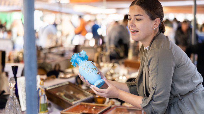 Woman with blue vase.