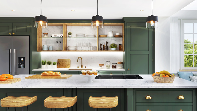 Forest green kitchen cabinetry and island