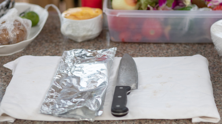 Aluminum foil and a knife