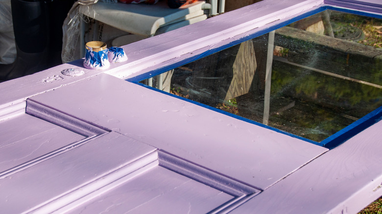 glass pane door with fresh purple paint