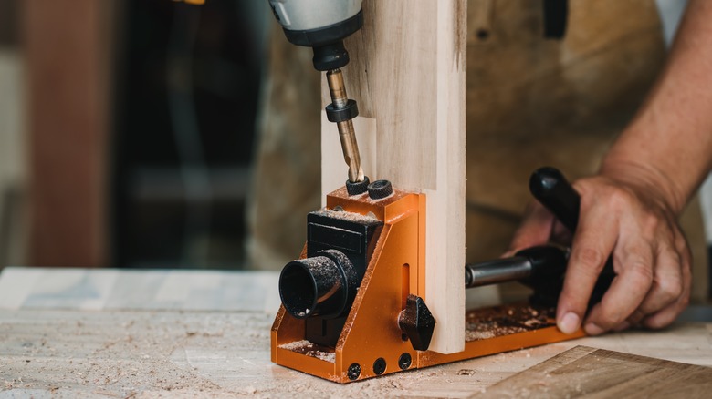 A pocket hole jig is used to align the drill perfectly for a particular angle