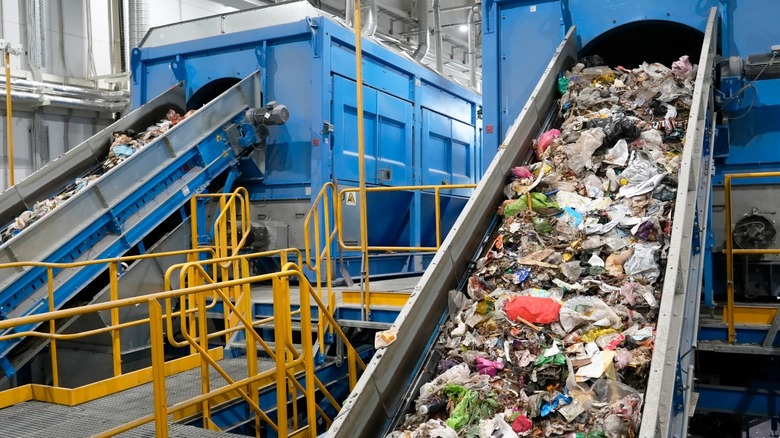 Plastic waste on a conveyor in a processing center