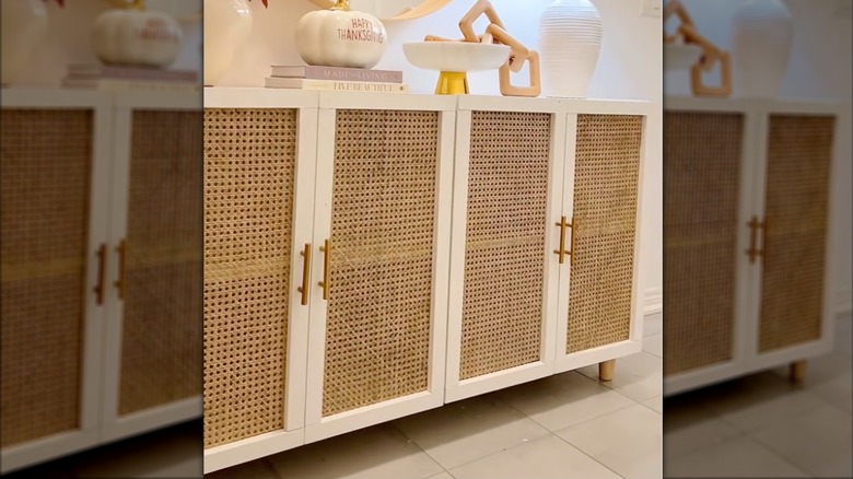 IKEA KALLAX entry console customized with woven rattan doors, decorative feet, and hardware