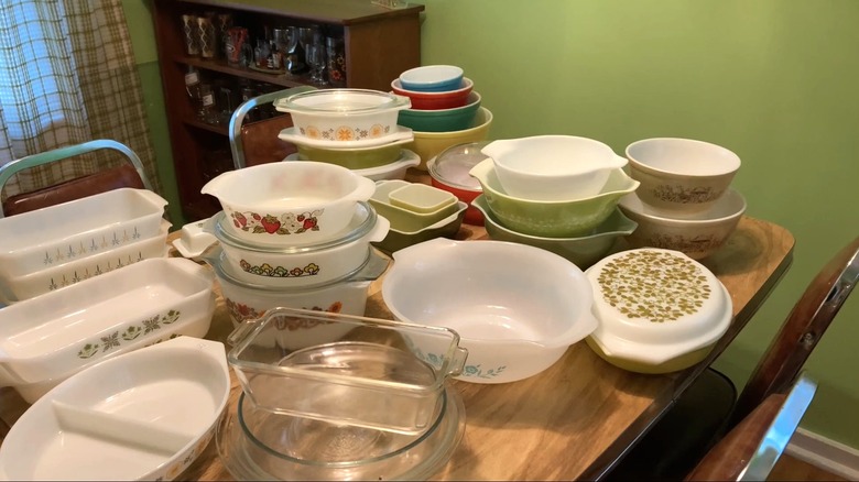 Vintage Pyrex dishes stacked on kitchen table