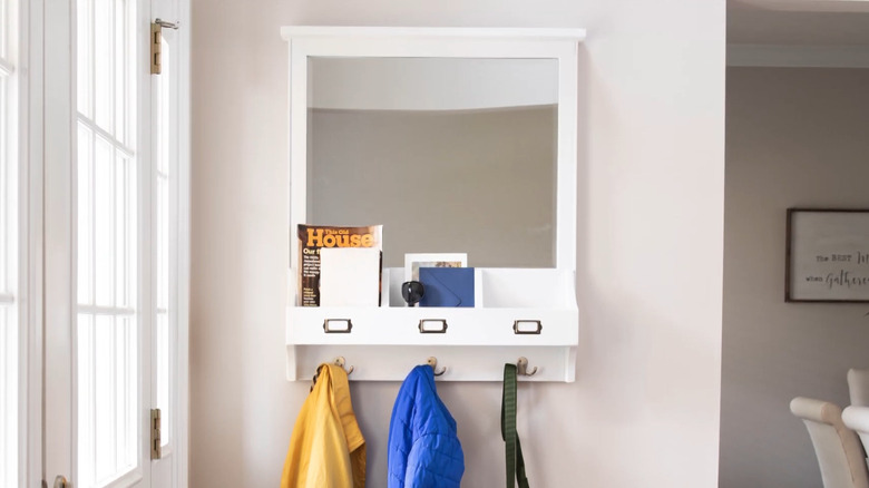 A DIY organizer hanging in an entryway