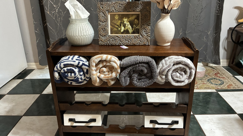 Old wooden wine rack turned into bathroom organizer