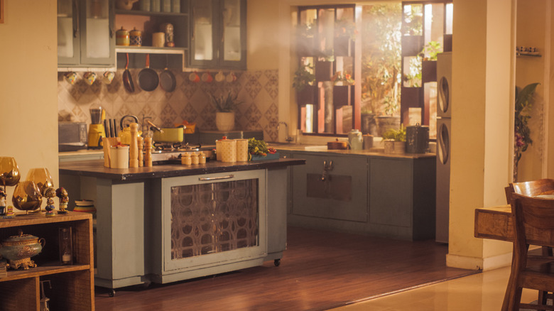 cozy kitchen with planter box windows and eclectic decor