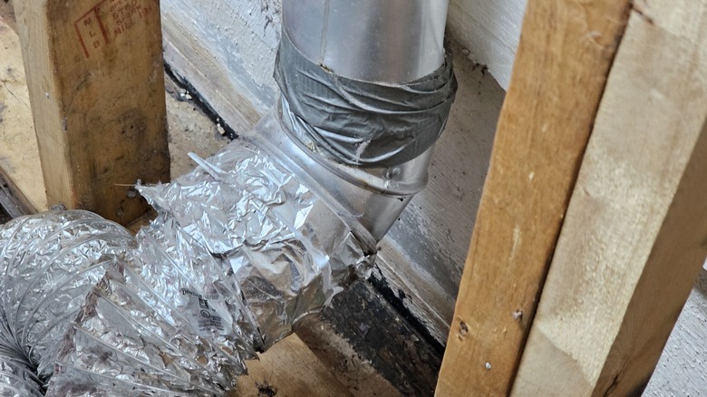 Dryer vent improperly attached with duct tape