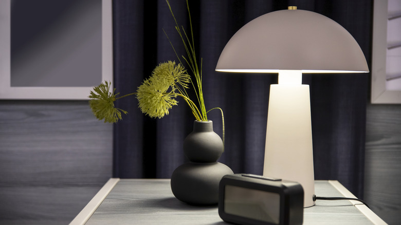 a mushroom lamp on a bedside table