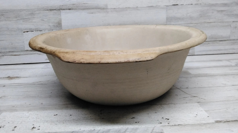 A vintage Pampered Chef bowl on a wood surface
