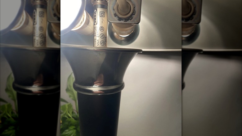Vintage IKEA DAKAPO lamp with identifying sticker near lightbulb