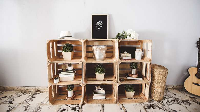 Stacked wooden crates with items in them