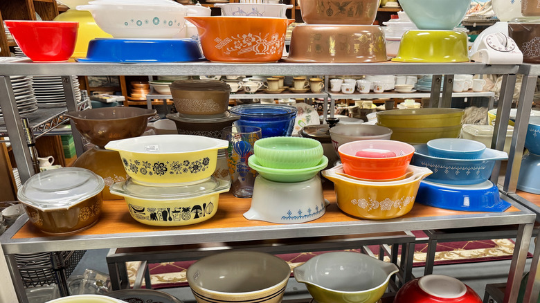 A display of vintage Pyrex dishes at a thrift store