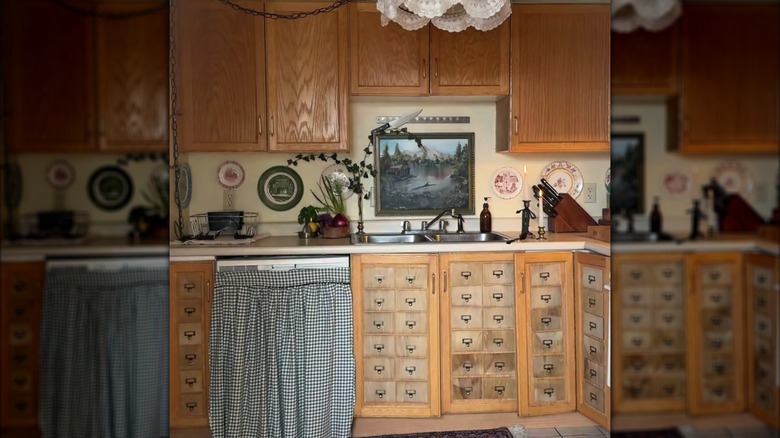 Honey oak cabinets with faux wood plank drawer fronts attached to them