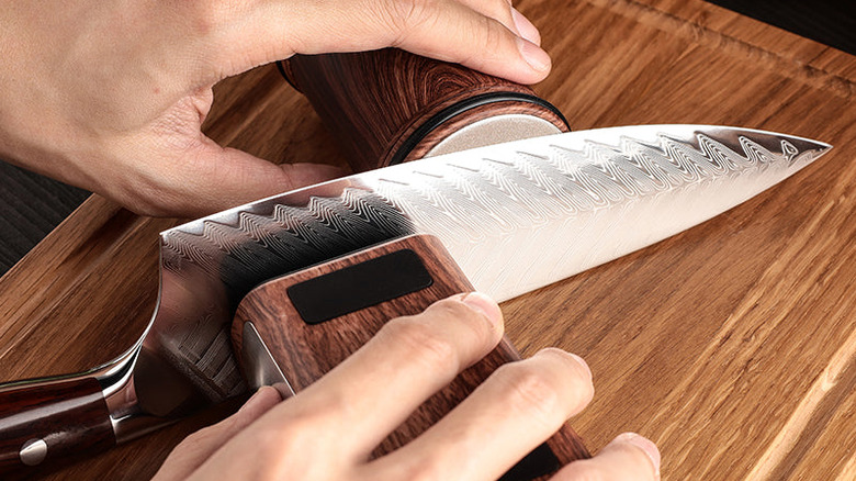 overhead view of wood-grain rolling knife sharpener