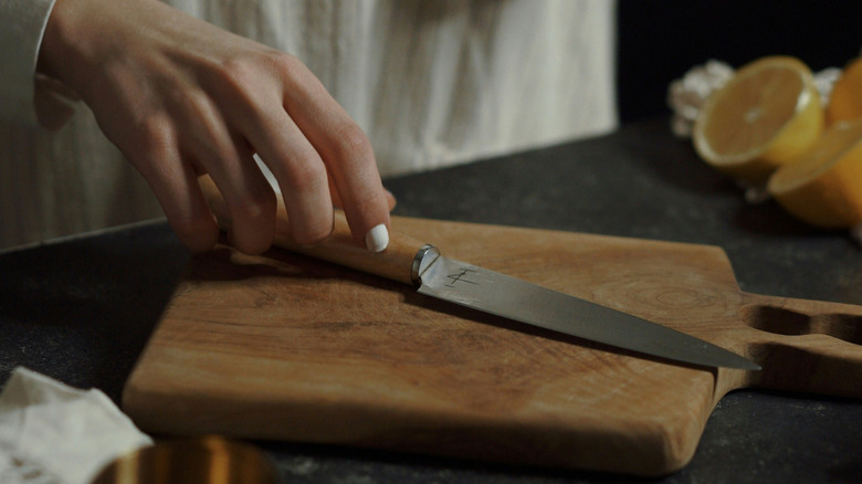 Knife on a wooden cutting board