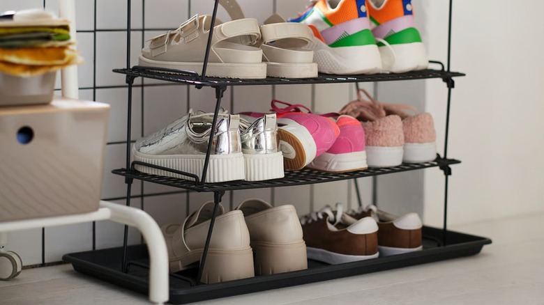 IKEA GREJIG Shoe Rack in entryway full of colorful shoes