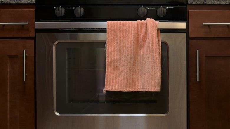 Kitchen towel hung on oven handle