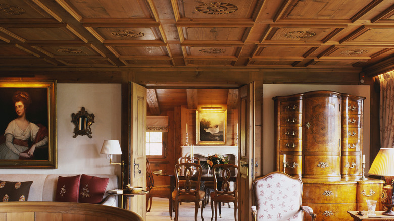 An old home with wood walls, chests, and gates