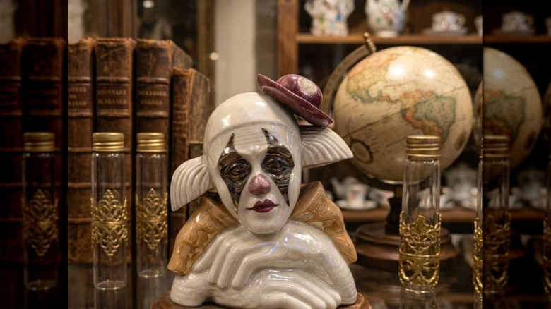 A sad clown bust in a thrift store