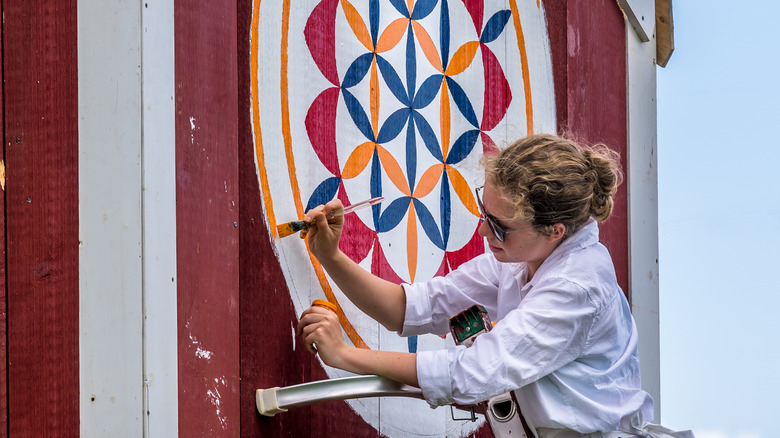 a hex sign-painting demonstration at a Kutztown folk festival