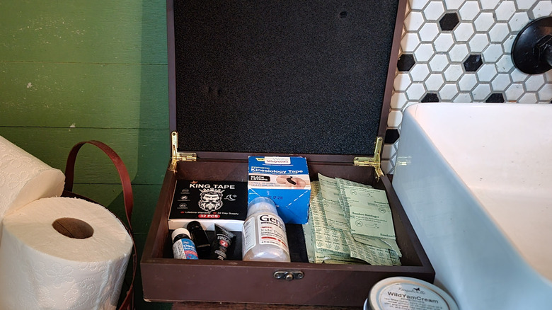 First aid items stored in a cigar box