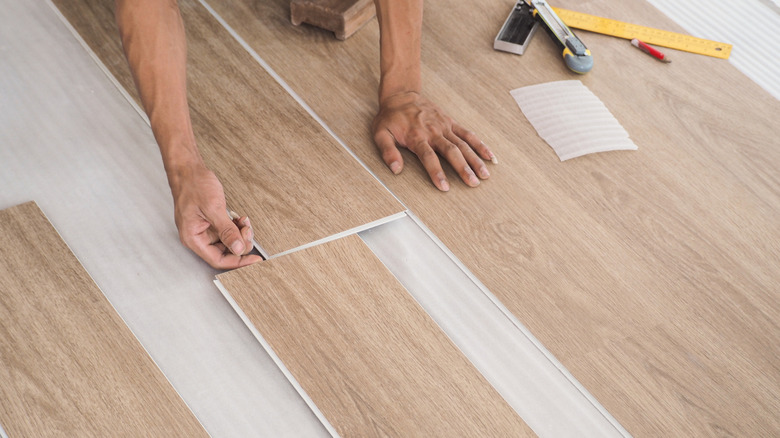 Person installing LVP flooring