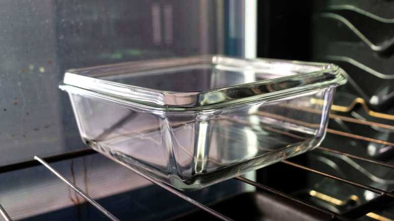 A glass baking dish sitting on an oven rack