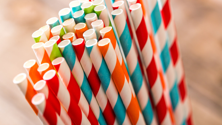 A collection of various colors of striped paper straws