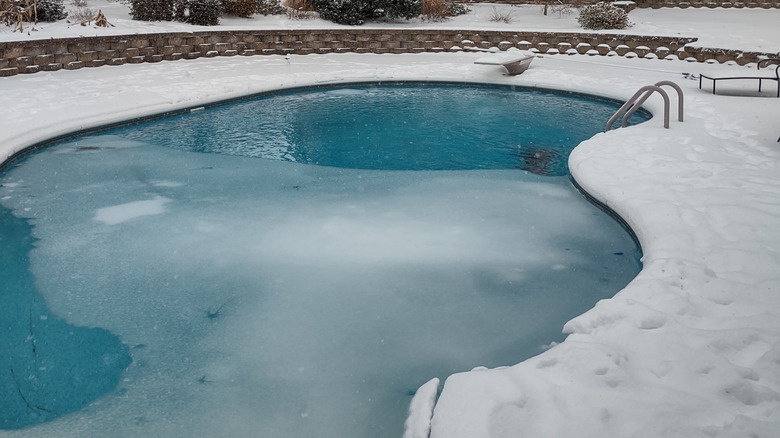 frozen in-ground pool in winter