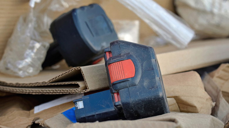 Tool batteries amid packing materials