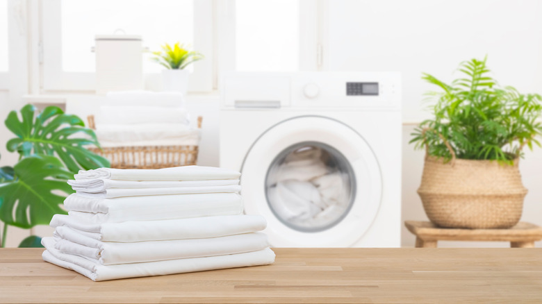clean sheets with washing machine in the background