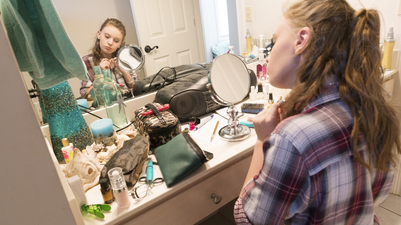person in front of messy counter