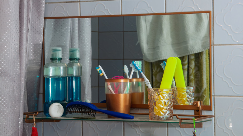 bathroom shelf with mouthwash bottle