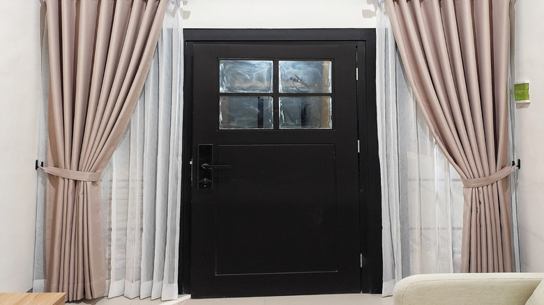 Curtains hung over a home's front door