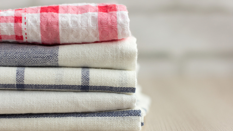 stack of kitchen towels resting on table