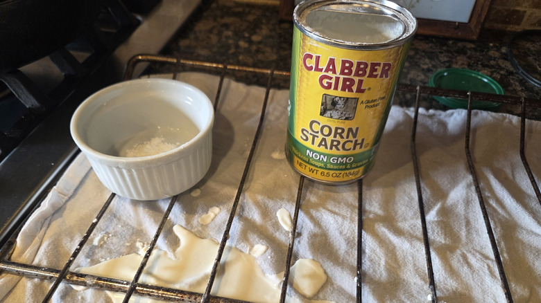 an oven rack with a gluey cornstarch mess that fell through the wires