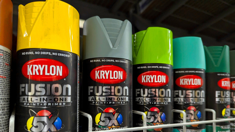 Lineup of colorful spray paint bottles in the store