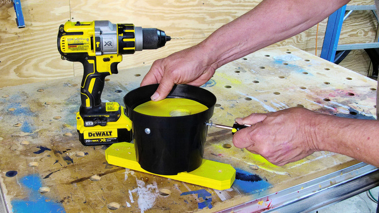 Securing the front of the birdhouse with screws