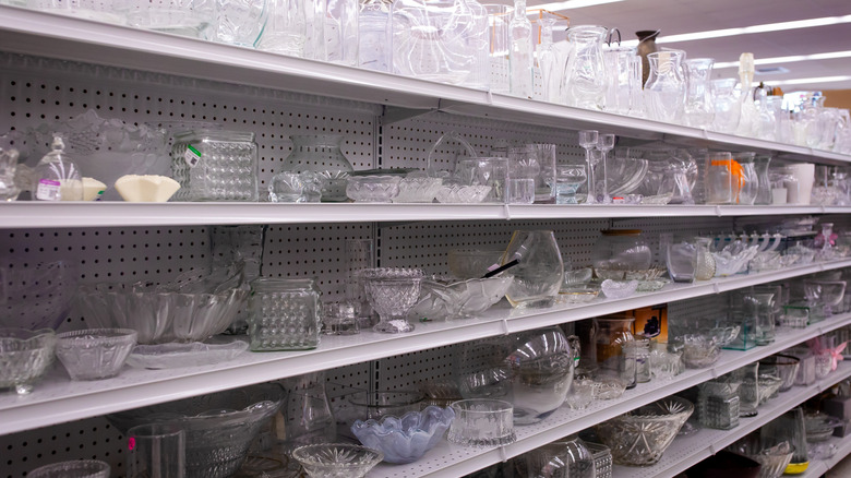 Shelves of assorted glassware in a store