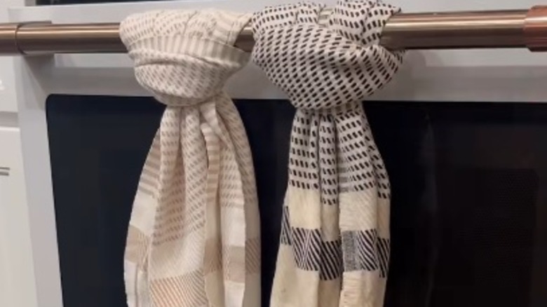 Towels tied around oven handle