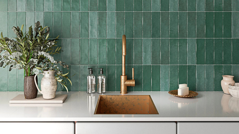 A green, vertical stacked subway tile backsplash