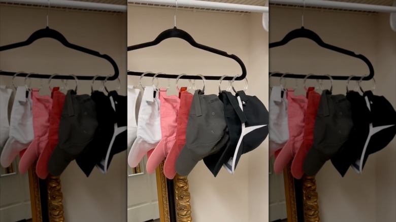 hats hanging on shower curtain rings