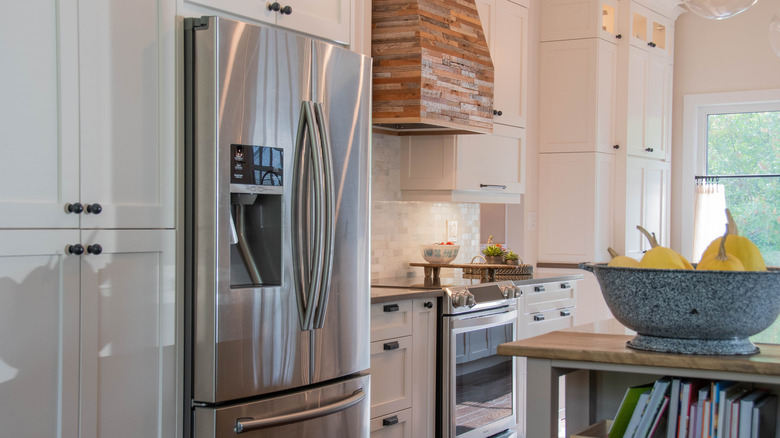 Kitchen with a stainless steel refrigerator and oven