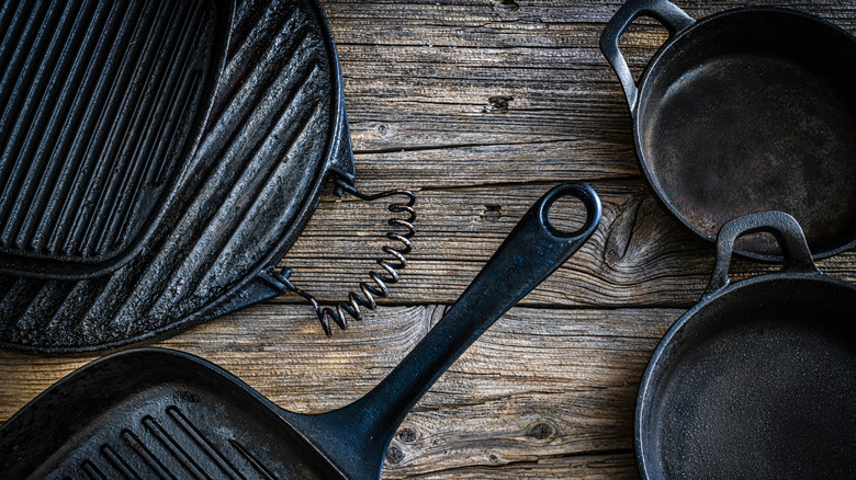 Stack of cast iron skillets for sale